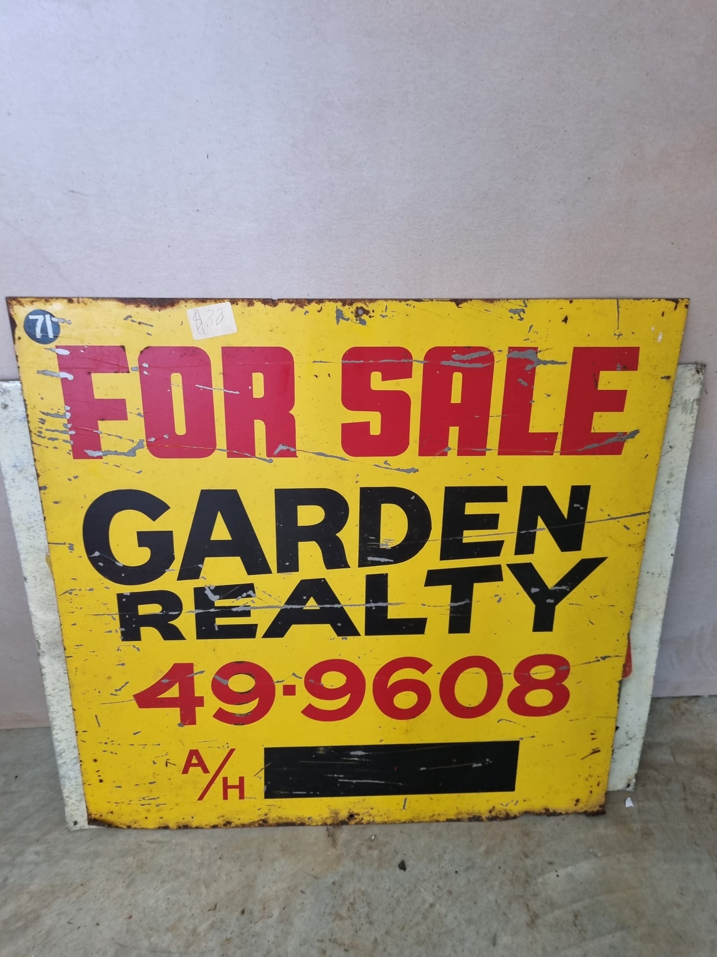 Vintage realty sign, tin mancave
