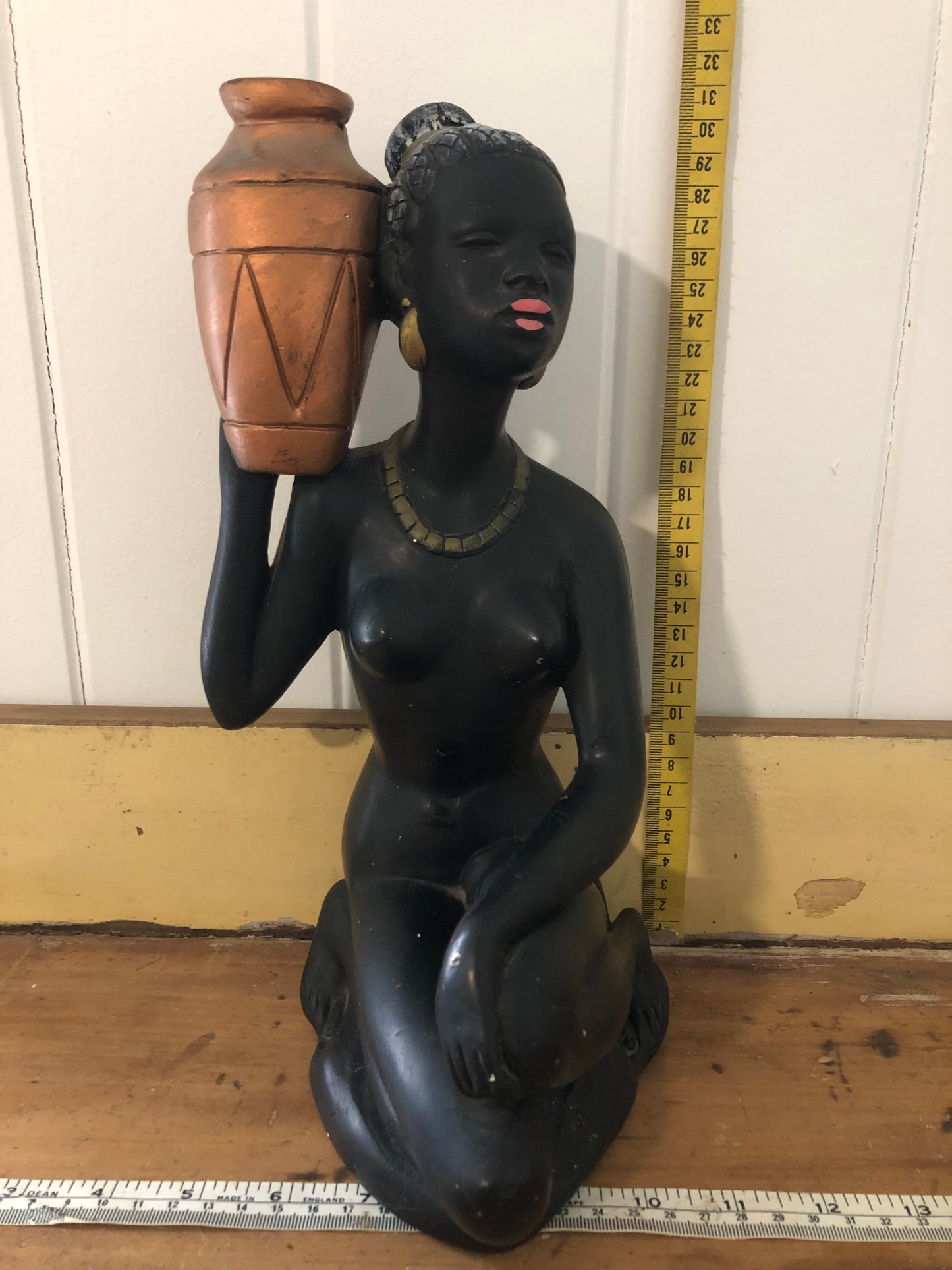 Lady with water jug. Black